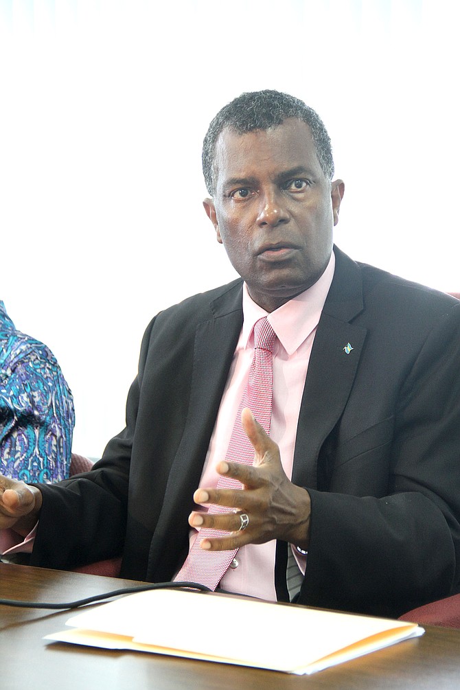 Minister of Foreign Affairs and Immigration Fred Mitchell at a press conference at the Department of Immigration on Sunday. 