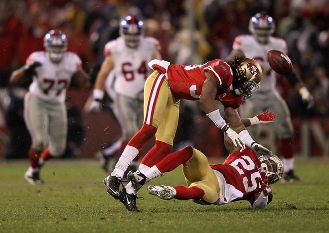 49ERS cornerback Tarell Brown collided hard with teammate and safety guard Dashon Goldson while attempting to intercept a ball thrown by Giants quarterback Eli Manning.