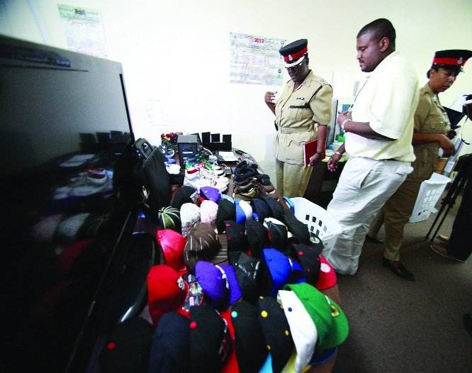 Officers with some of the stolen goods.
