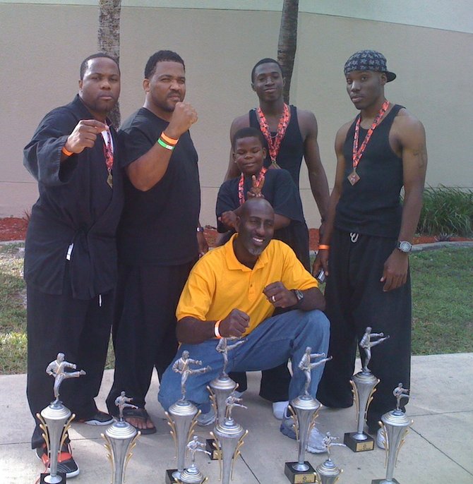 Sensie Winston Penn (front row) is flanked by Corey 'DJ' Counsellor' Rolle, Sensie Jason Basden and a few young martial artists.