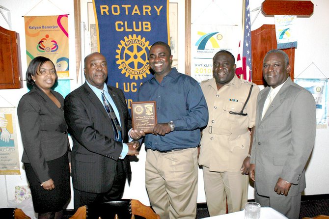 FROM LEFT: Rotary president Cassietta Z McIntosh, GB Road Traffic deputy controller Basil Rahming, Mr Evans, Asst Supt Kenwood Taylor and GB Road Safety Committee co-chairman John Fraser.