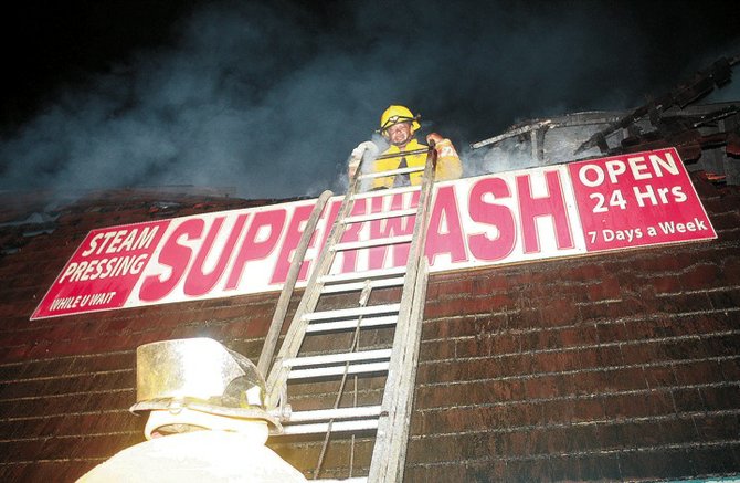 Firefighters tackling the blaze at Superwash