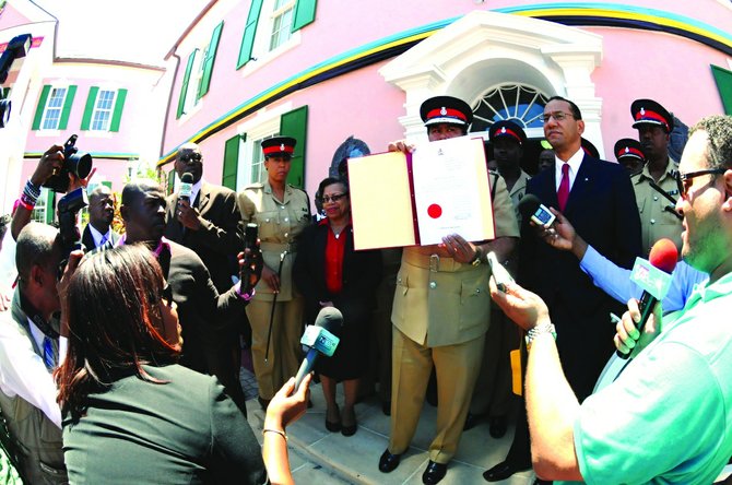 Ellison Greenslade, in his role as Provost Marshall, shows the document making the dissolution of Parliament.