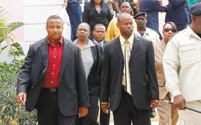 Cpl Charles Antoine and Constable Eddison Nairn outside of court on Monday.