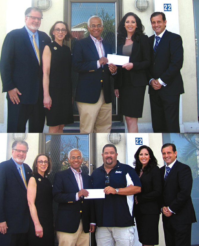 Two cheques are handed over to the Bahamas Breast Cancer Initiative. In the top picture are: Former US Ambassador to the Bahamas Ned Siegel and his wife Stephanie, Dionisio D'Aguilar, Michelle Rassin and Robert Carron at the handover. In the bottom picture a second cheque for $5,000 is presented by Adam Darville, president of the Rotary Club of East Nassau.