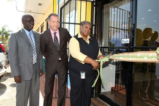 Pictured at the BTC Shirley Street Ribbon Cutting are Tellis Symonette, Geoff Houston & Maurine Prescod.