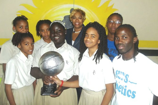 Temple Christian girls show off their second place trophy. In back is principal Christine Porter. Coach Keno Demeritte is right.
