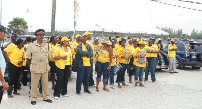 PLP supporters look on during advanced voting.