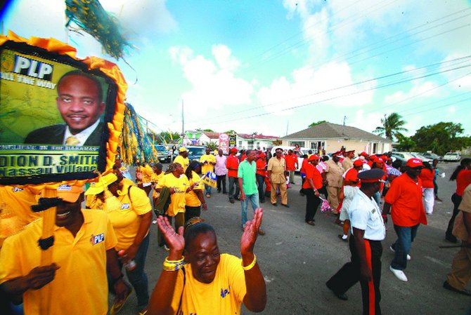 PLP supporters heckle the Prime Minister during his walkabout.