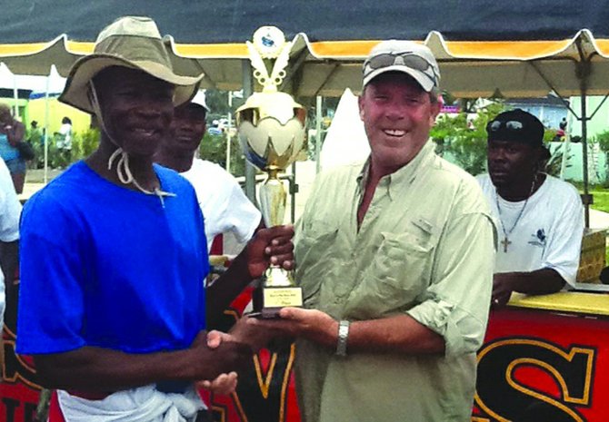 JOSH GREEN (left) accepts his award from James 'Jimmy' Sands