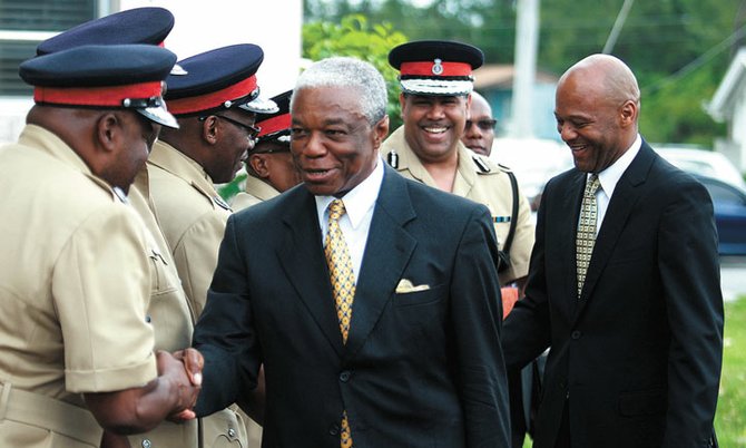 STATE Minister for National Security Keith Bell (right) and Minister of National Security Dr Bernard Nottage (centre) meet with police officers this week.