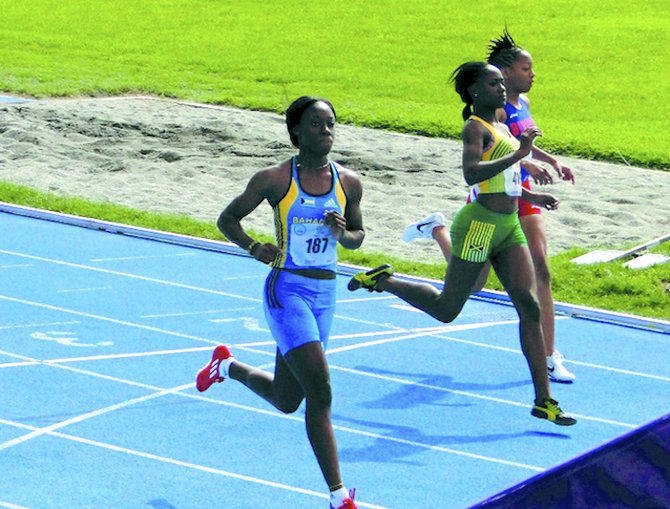 CARMEISHA COX (far left) won silver in the 200 meters on Saturday night.