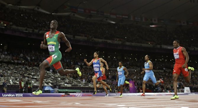 Grenada's Kirani James, left, crosses the finish line to win gold ahead of, from second left, Dominican Republic's Luguelin Santos, Bahamas' Demetrius Pinder, Bahamas' Chris Brown, and Trinidad's Lalonde Gordon, in the men's 400-meter final during the athletics in the Olympic Stadium at the 2012 Summer Olympics, London, Monday. (AP)