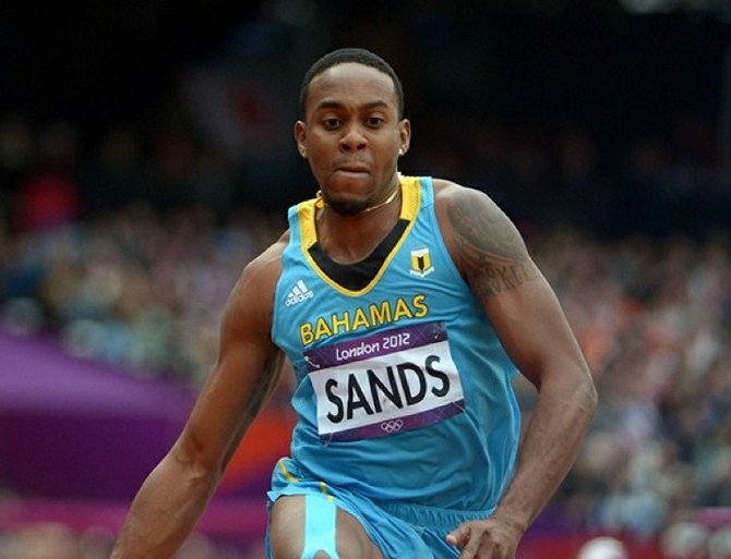 Leevan Sands bounds an automatic qualifying mark of 56-4 (17.17m) in the mens triple jump quallifying during the London 2012 Olympic Games at Olympic Stadium.  Kirby Lee-USA TODAY Sports