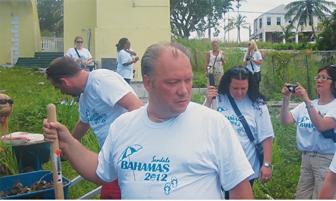 Workers helping to create a vegetable garden at the headquarters of the Bahamas AIDS Foundation.