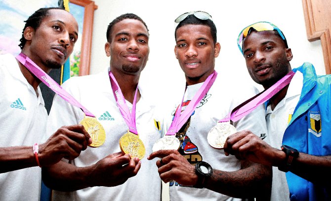 THE gold medal winning quartet of, from left, Chris Brown, Michael Mathieu, Demetrius Pinder and Ramon Miller show off their gold medals. Photos: Felipé Major/Tribune Staff
