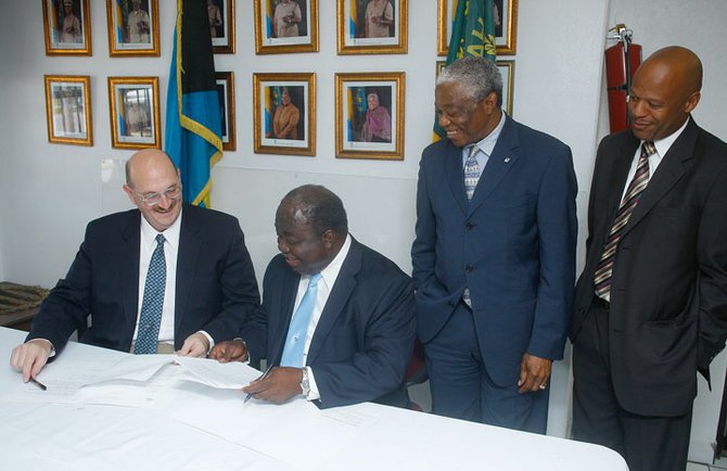 Minister of National Security Bernard Nottage and Minister of State in the Ministry of National Security Keith Bell look on as US Chargé d’Affairs John Dinkelman hands over documents and contraband detection equipment  valued at $50,000 to Superintendent of Her Majesty Prison Ellison Rahaming.Photos: Tim Clarke/Tribune Staff
