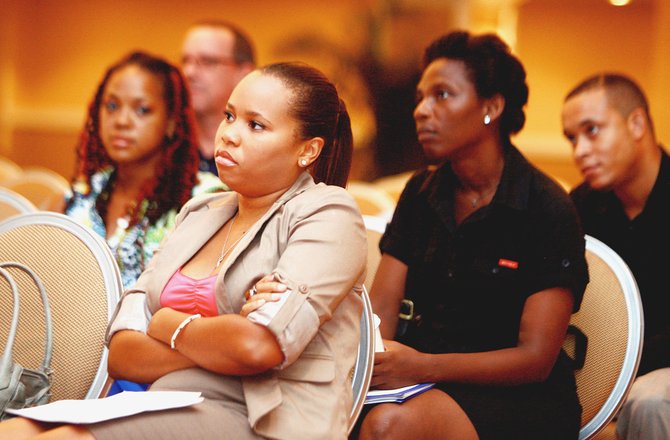 Audience members listen during the Bahamas Crisis Centre's Regional Peace Conference.