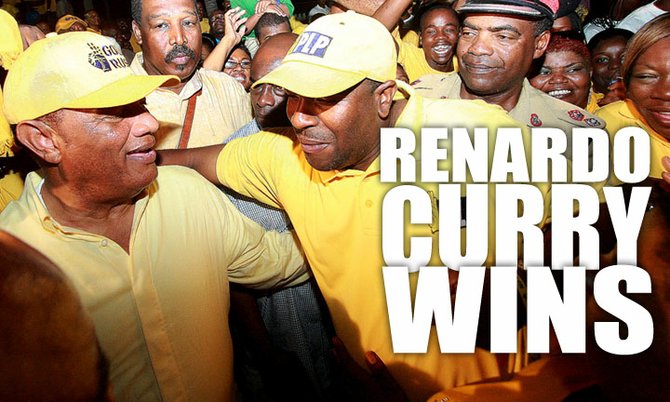 Prime Minister Perry Christie congratulates Renardo Curry on Monday night. Photo: Felipé Major/Tribune staff