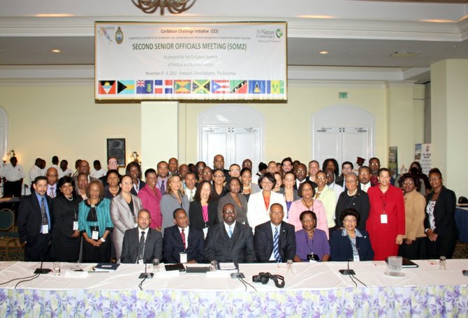 Environment and Housing Minister Kendred Dorsett, seated centre, along with Minister for Grand Bahama, Dr Michael Darville, and delegates at the Caribbean Challenge Initiative two-day conference.