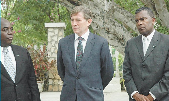 Governor Damian Todd extends an invitation to the Bahamian Delegation to his Turks and Caicos residence, Waterloo. Governor Todd is standing in between Deputy Prime Minister Philip Davis and Foreign Affairs and Immigration Minister Fred Mitchell. (Photo: Gena Gibbs/BIS