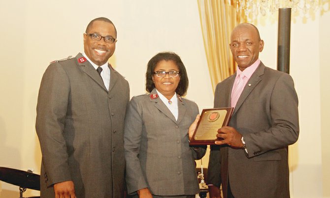 Divisional Commander of the Salvation Army Major Lester Ferguson (left), wife of the Territorial Commander of the Salvation Army for the Caribbean Colonel Edmane Castor and Superintendent of police, Stephen Dean.