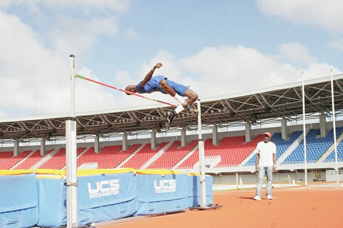 RAISING THE BAR: LaQuan Nairn clears the bar Saturday in the Road Runners Track and Field Classic at the new Thomas A Robinson Track and Field Stadium.
                                                                                                                                                                                                                                                                               Photo by Kyle Smith/Tribune Staff