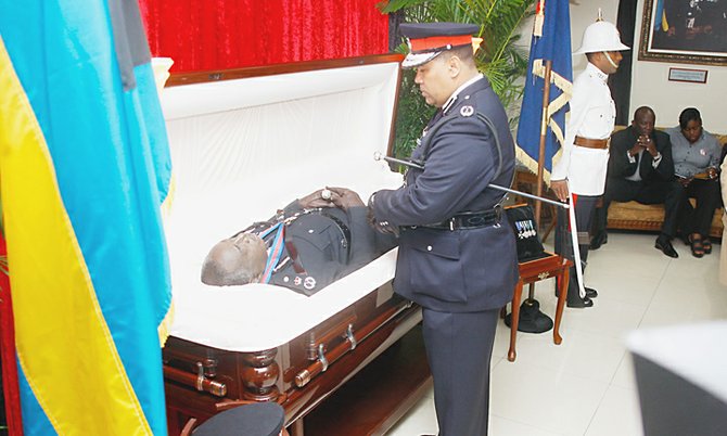 Commissioner of Police Ellison Greenslade pays his respects. Photo: Tim Clarke/Tribune Staff.
