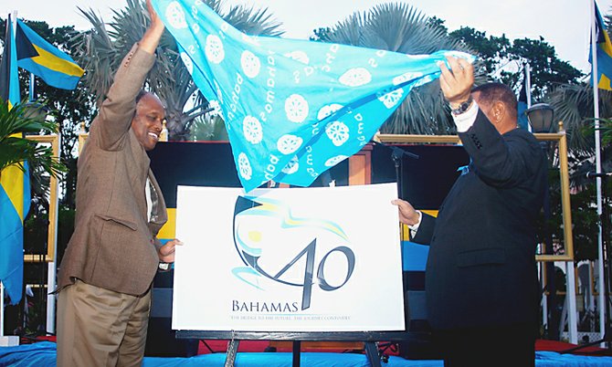 Prime Minister Perry Christie and Charles Carter unveil the 40th Independence Logo in Rawson Square yesterday.