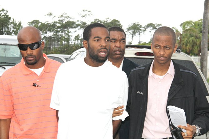 DAVID Alexander Stuart (white t-shirt) outside of court.