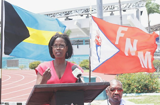 EVENT coordinator Shonnel Ferguson (speaking above) said the FNM’s memorial track and field classic for the late Charles Maynard is set for August 17. Party leader Hubert Minnis looks on.
