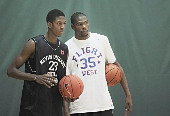 Danrad Knowles (left) gets a few pointers from NBA star Kevin Durrant.
