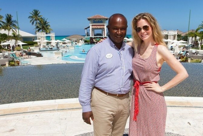 Hotel Manager at Sandals Emerald Bay David Latchimy poses for a photo with “True Blood” star Kristin Bauer.
