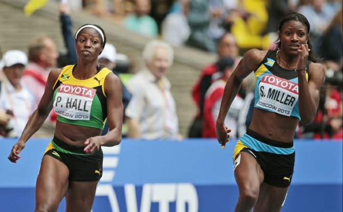 Bahamas' Shaunae Miller, right, and Jamaica's Patricia Hall compete in a women's 200-metre heat at the World Athletics Championships in the Luzhniki stadium in Moscow, Russia.