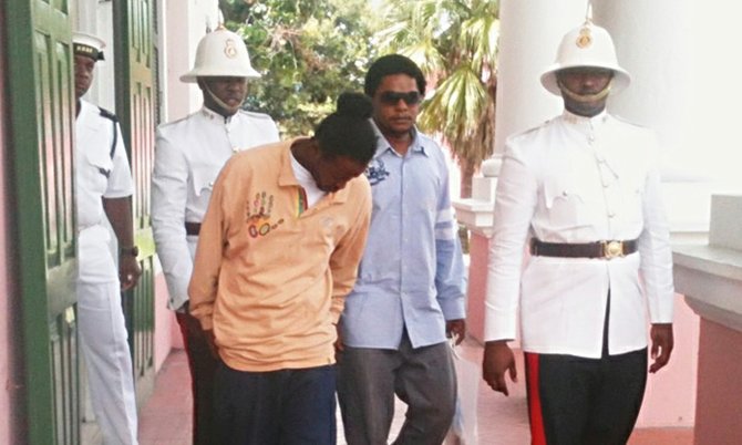 Rodney Sylvester (centre left) and Charles Panday (centre right) exiting court after being unanimously acquitted of murder.