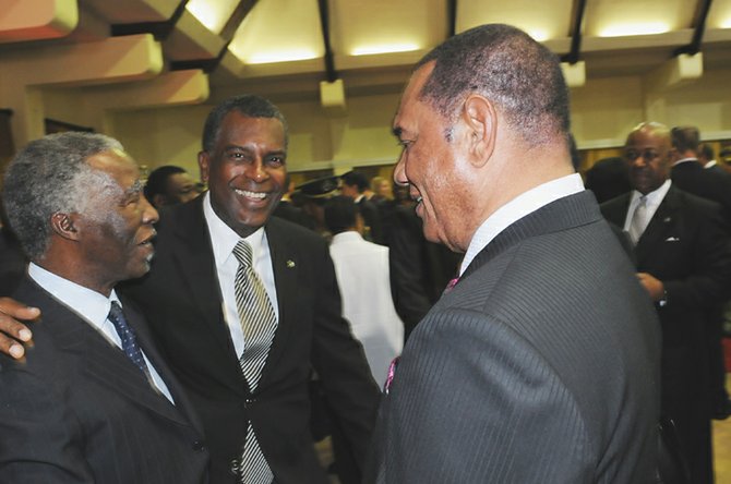 Prime Minister perry Christie and Foreign Minister Fred Mitchell talk to Thabo Mbeki, former South Africa president, at the presidential lodge.