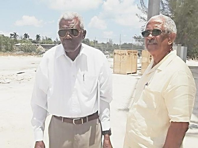 Thomas A. Robinson and Winston 'Gus' Cooper on construction site for new TAR Stadium.