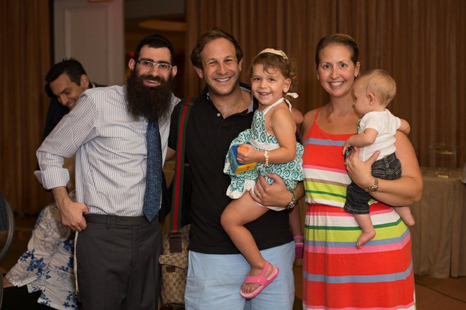 Rabbi Sholom Bluming (far left) with members of the Bahamas’ Jewish community.
