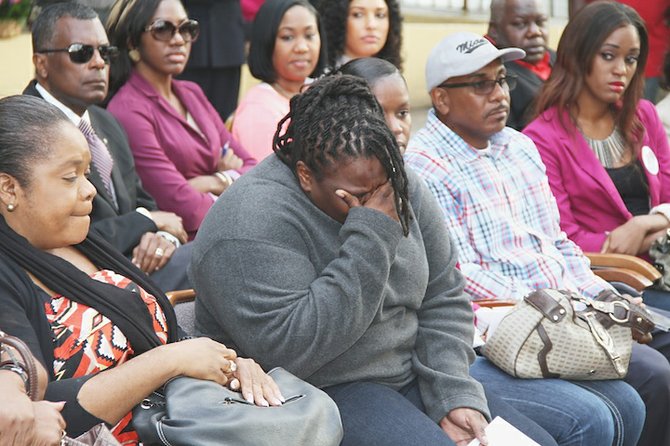 Tears at an event held Thursday by BTC to donate $8,000 to the families of the four people killed in Fox Hill in December.
