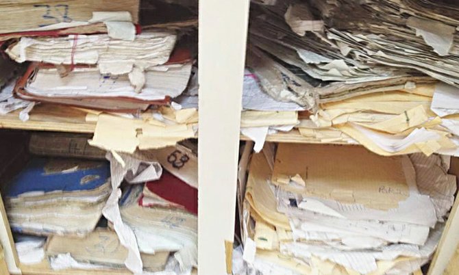 Some of the stacks of files said to be part of the Supreme Court backlog - stacked in tattered folders and in poor condition.