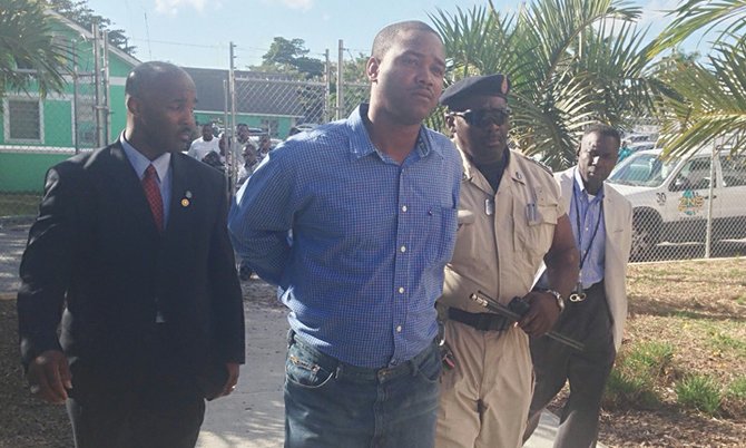 Constable Narado Rolle is escorted to court.