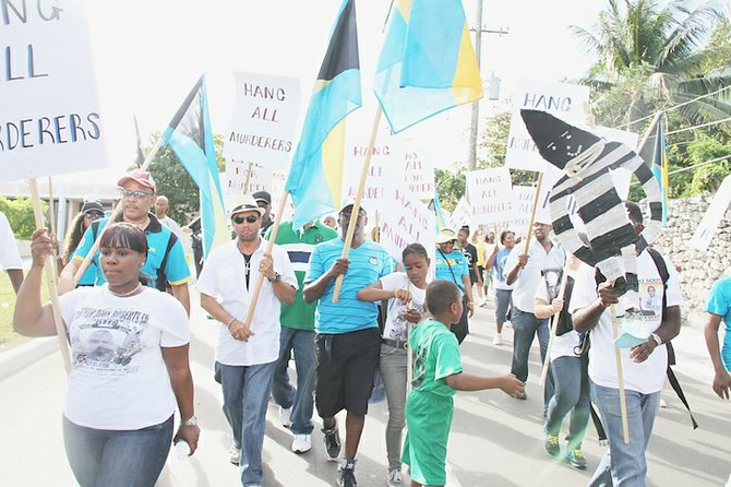 Marchers including Dr Duane Sands and Branville McCartney took to the streets on Saturday.