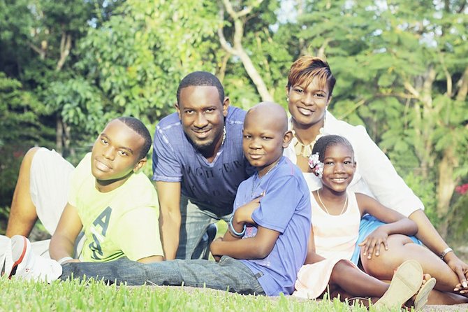 D'Quan (centre) with his family.
