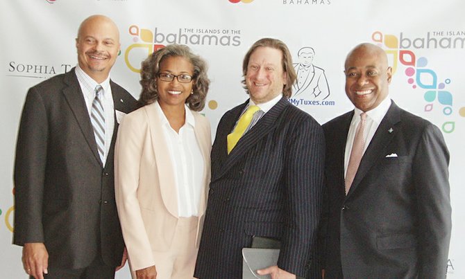 From left, Tourism Deputy Director General Ellison “Tommy” Thompson, Director of Romance Freda Malcolm, Elite Traveler Editor-in-Chief Doug Gollan and Minister of Tourism Obie Wilchcombe.