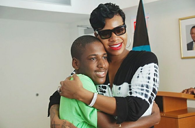 A HUG for American Idol star Fantasia Barrino from Rashad Bowe, 18. Photo: Shannon Crawford
