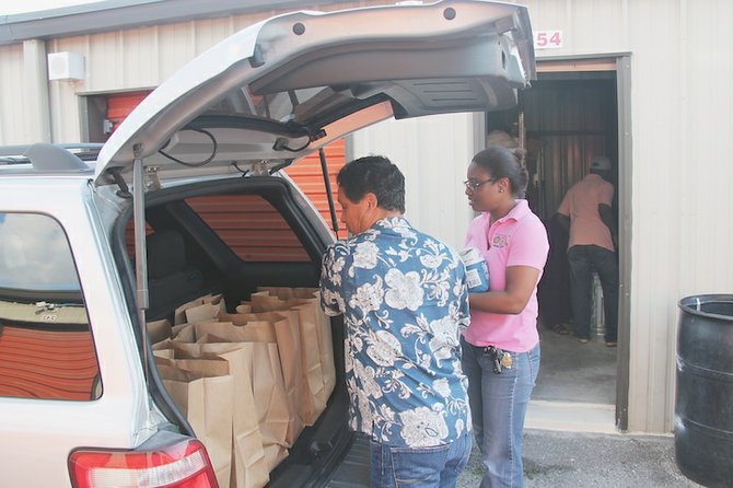 Members of the Rotary Club with goods to distribute to those in need in the community.