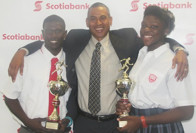 Xavier Coakley and Keoianna Albury share a moment with Scotiabank's new managing manager.