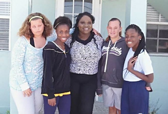 Tiffany Rahming (centre) with her scholars at the Trinity Preparatory Academy in Abaco.