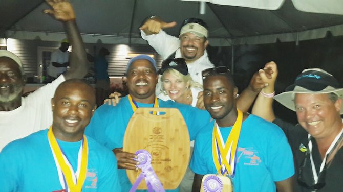 Grand Champions Gone Fishin’ celebrate their victory, joined by event organisers Alexis Garcia and Jenny Pinder.

