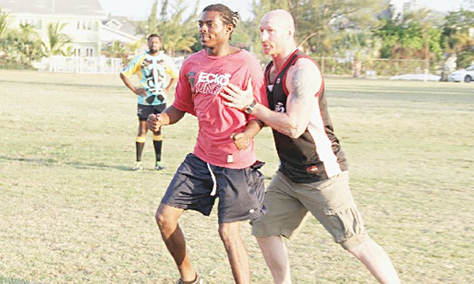 Gareth THOMAS runs drills with the backs, teaching them some set scrum and lineout plays.
 